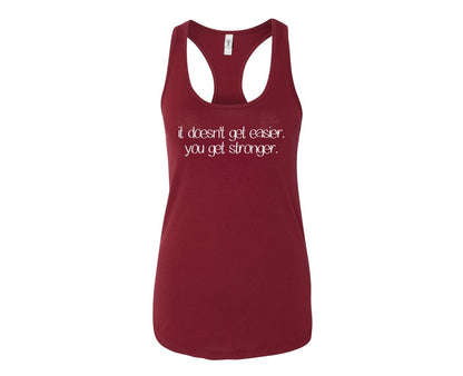 It doesn't get easier.  You get stronger. - Racerback Tank